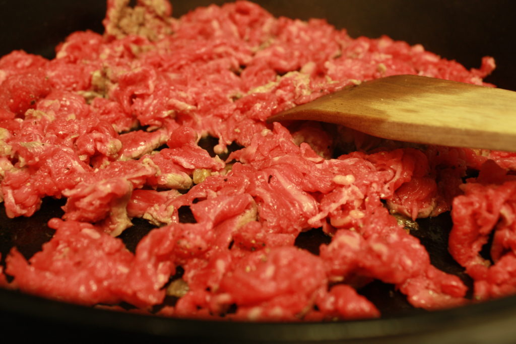 brown the thin sliced beef in a skillet.