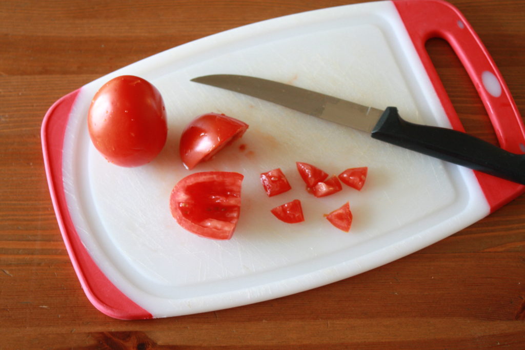 Small dice the roma tomatoes for the easy tomato basil bruschetta