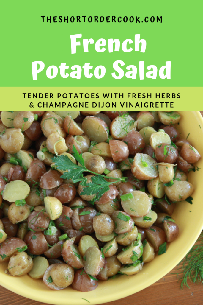 French Potato Salad topped with fresh herbs in a large bowl. 
