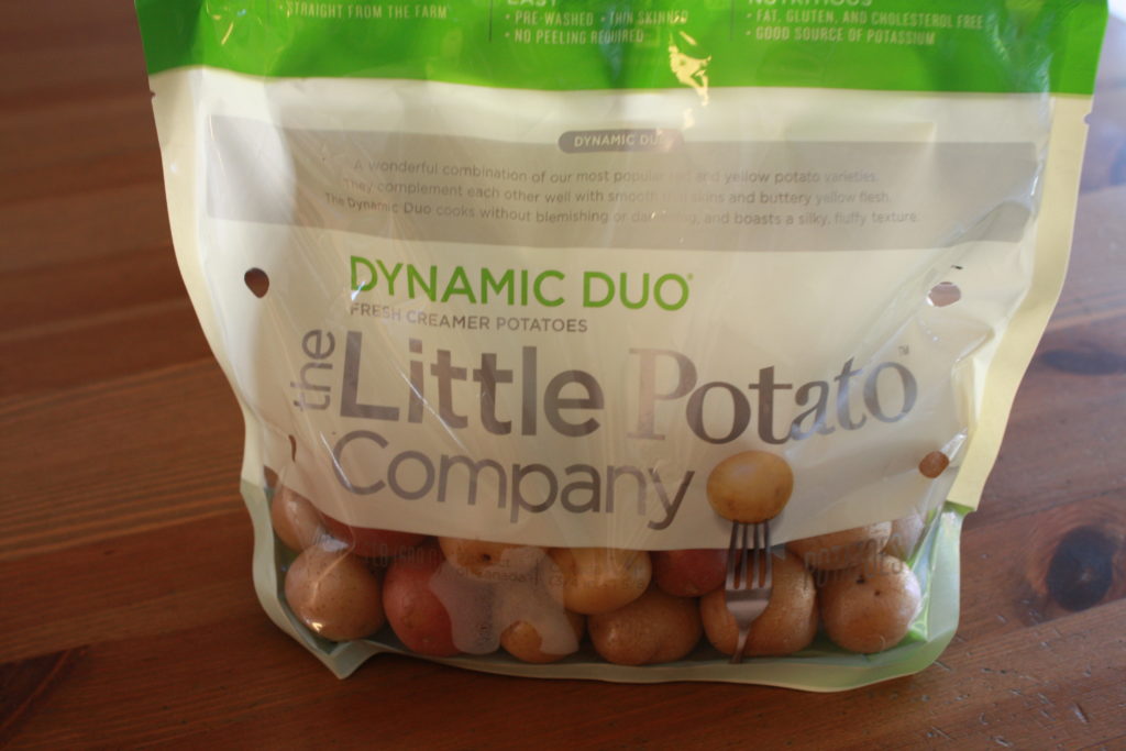 Little Potato Company - Dynamic Duo bag of small boiling potatoes in red and white.