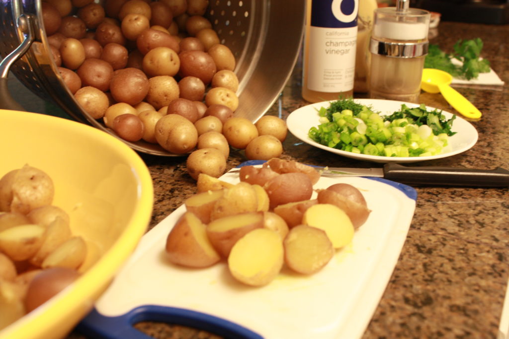 potatoes ready to slice on a cutting board