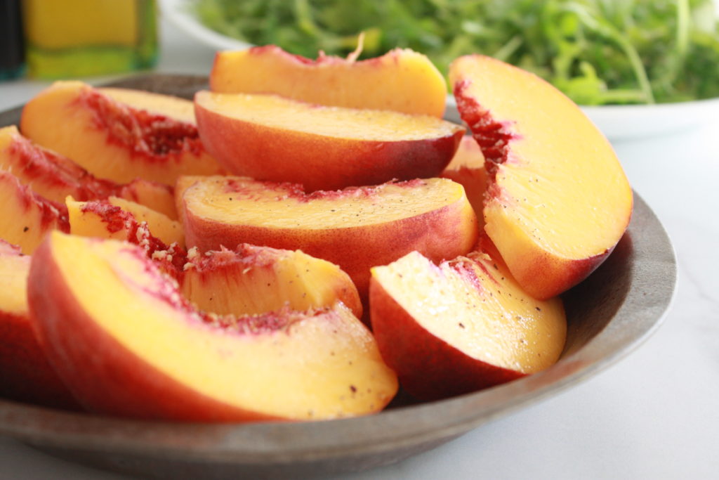 Sliced peaches ready for the grill
