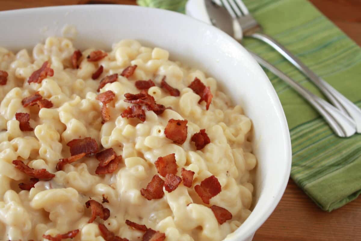 Classic Old-Fashioned Macaroni and Cheese with Caramelized Onions and Bacon in a casserole dish