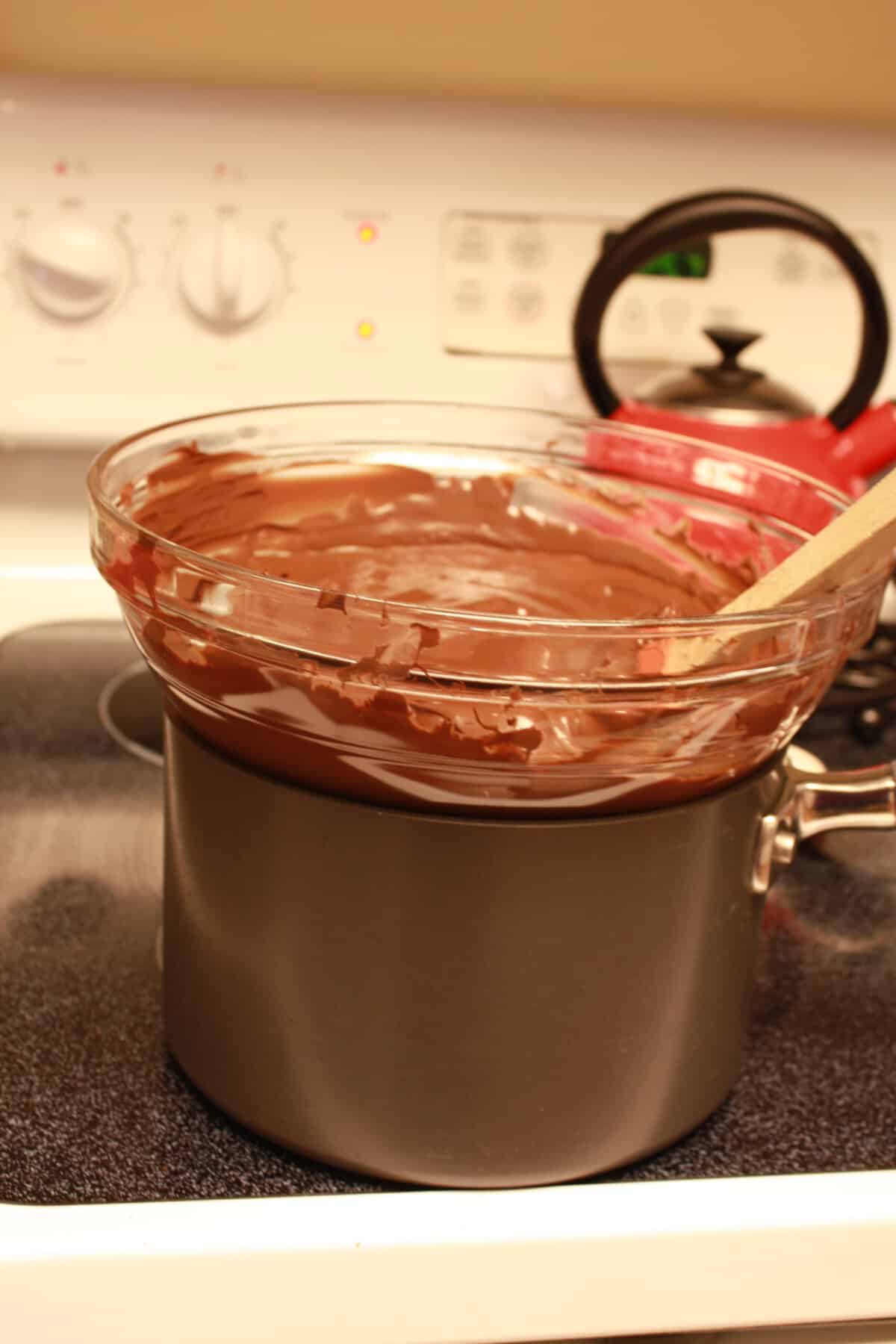 melt chocolate in a glass bowl over a pot of simmering water