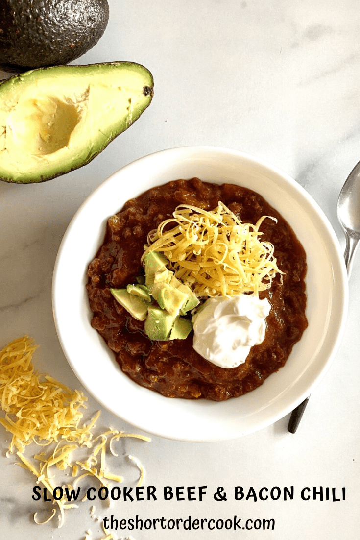 Slow Cooker Beef & Bacon Chili (no beans) in a bowl topped with cheese and avocado.