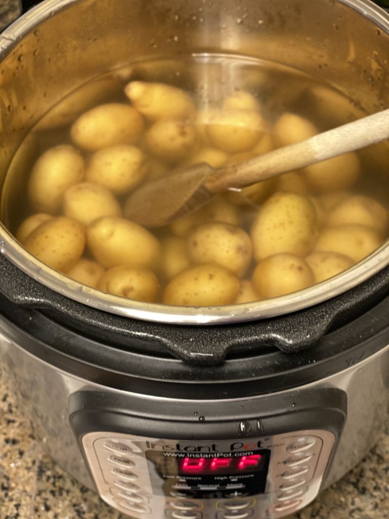 potatoes submerged in the salted water