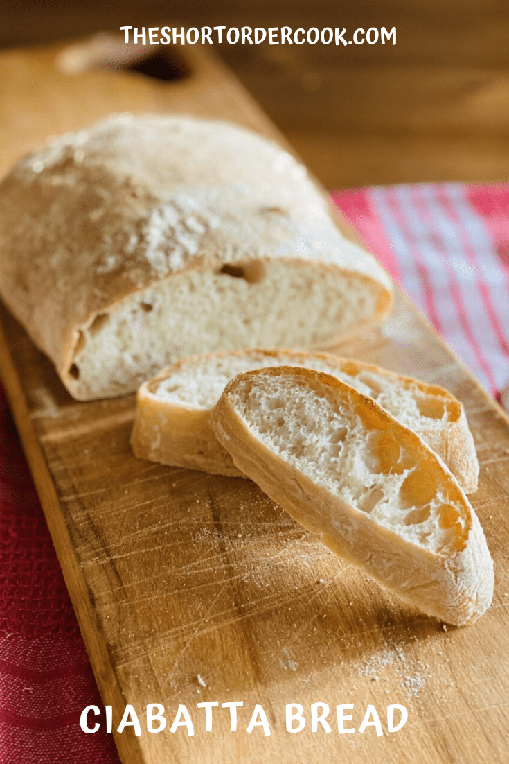 Ciabatta Bread sliced and ready on the cutting board.