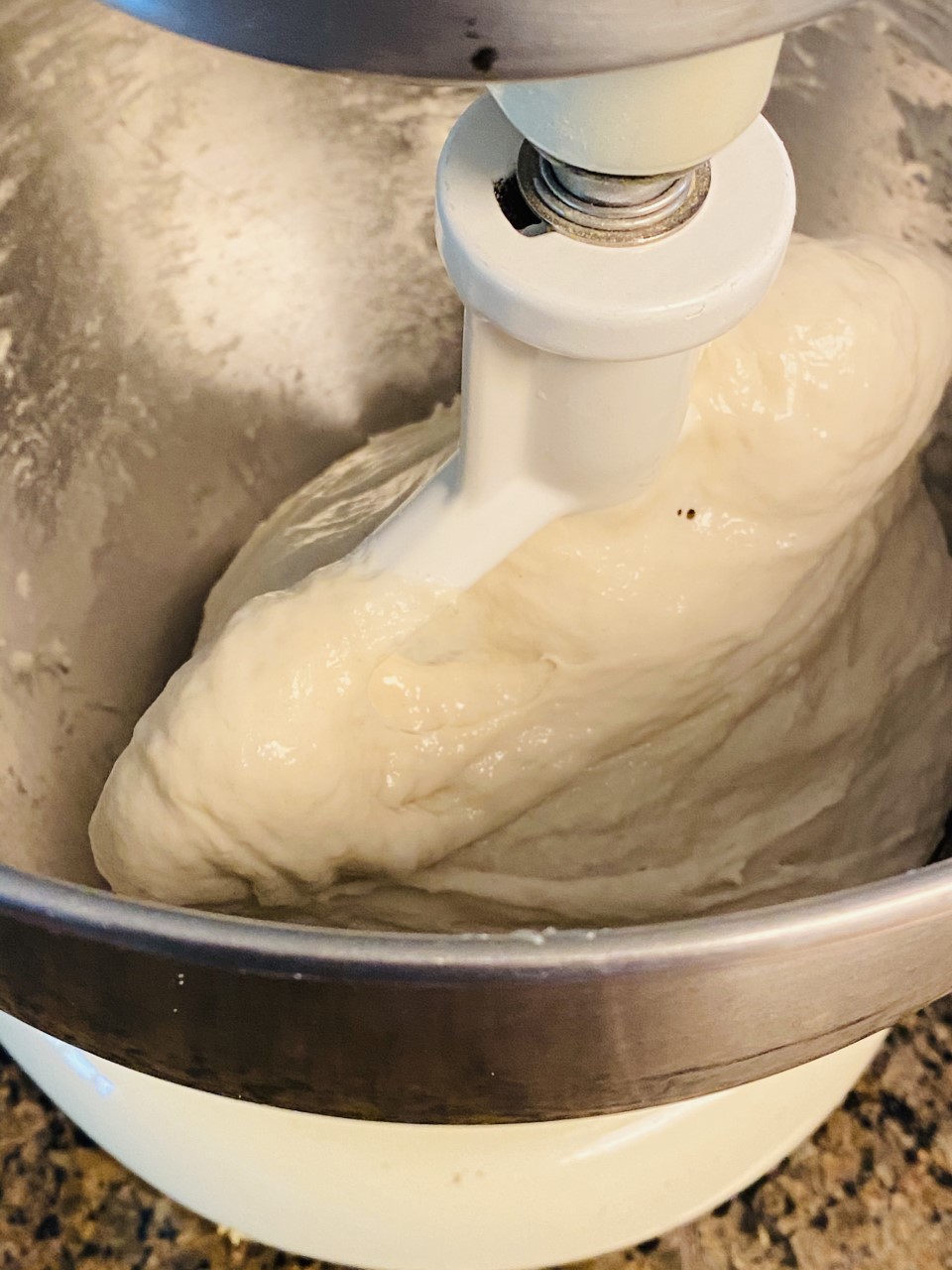 Ciabatta dough mixing in a stand mixer.
