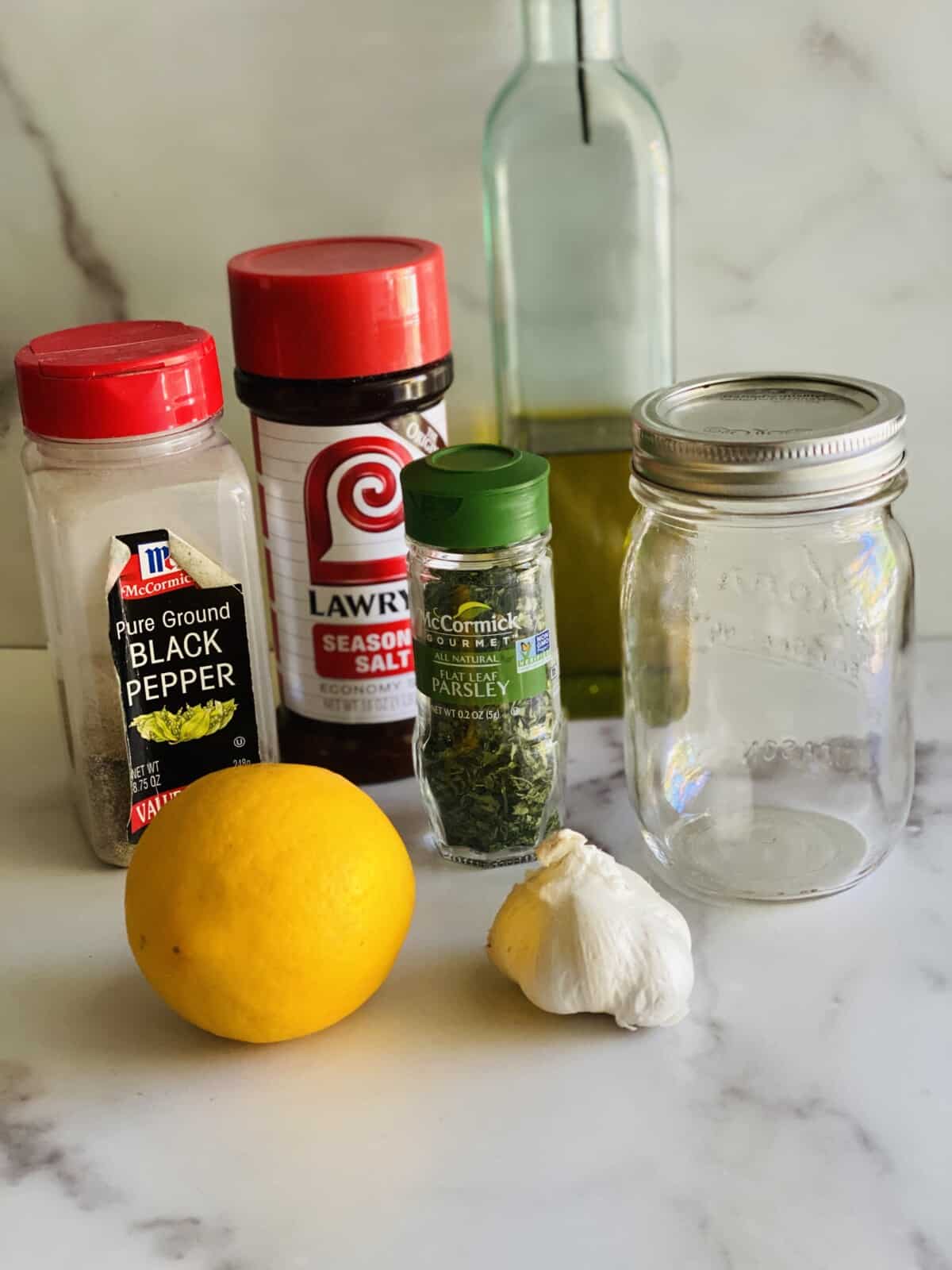 Ingredients on a table for lemon pepper marinade