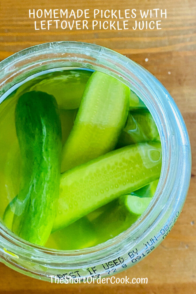 Jar full of new pickles sitting in leftover brine. 