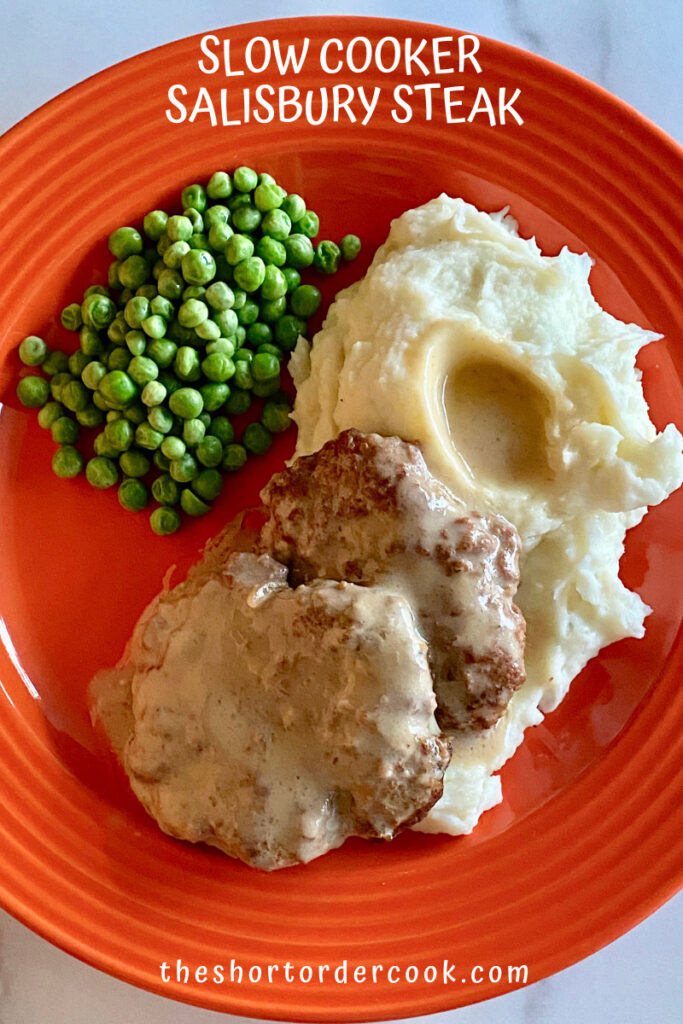 Slow Cooker Salisbury Steak plated with mashed potatoes and peas