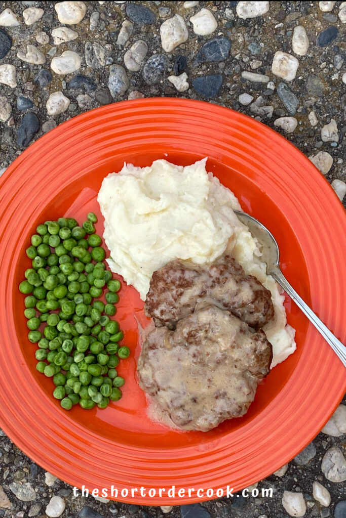 Slow Cooker Salisbury Steak Ready to enjoy with mashed potatoes and peas