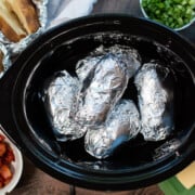 potatoes wrapped in foil and in the crock pot