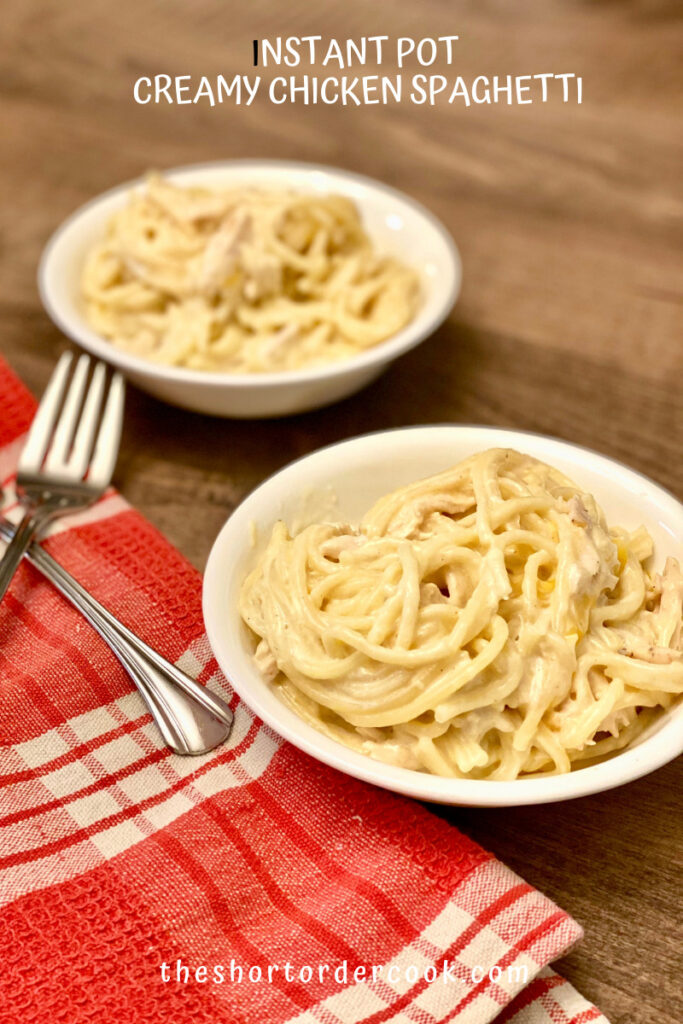 Instant Pot Creamy Chicken Spaghetti plates on two plates with forks