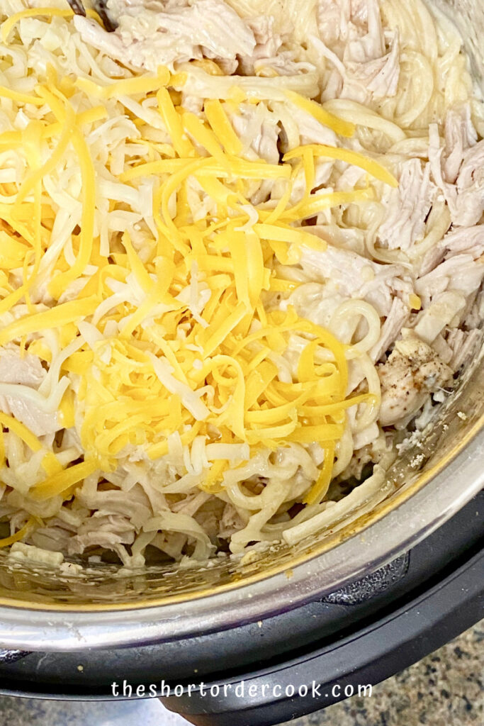 Instant Pot Creamy Chicken Spaghetti ready to stir in the cheese