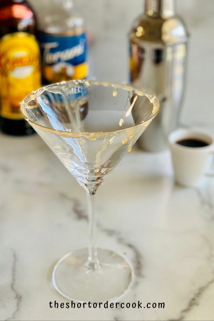Salted Caramel Espresso Martini glass rim prepped with caramel and sea salt flakes