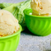 Best Ever Mango Ice Cream featured two bowls close mango bottom corner