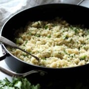 What To Serve With Scallops Cauliflower-Rice-in-a-Skillet-with-a-Spoon happykitchenrocks
