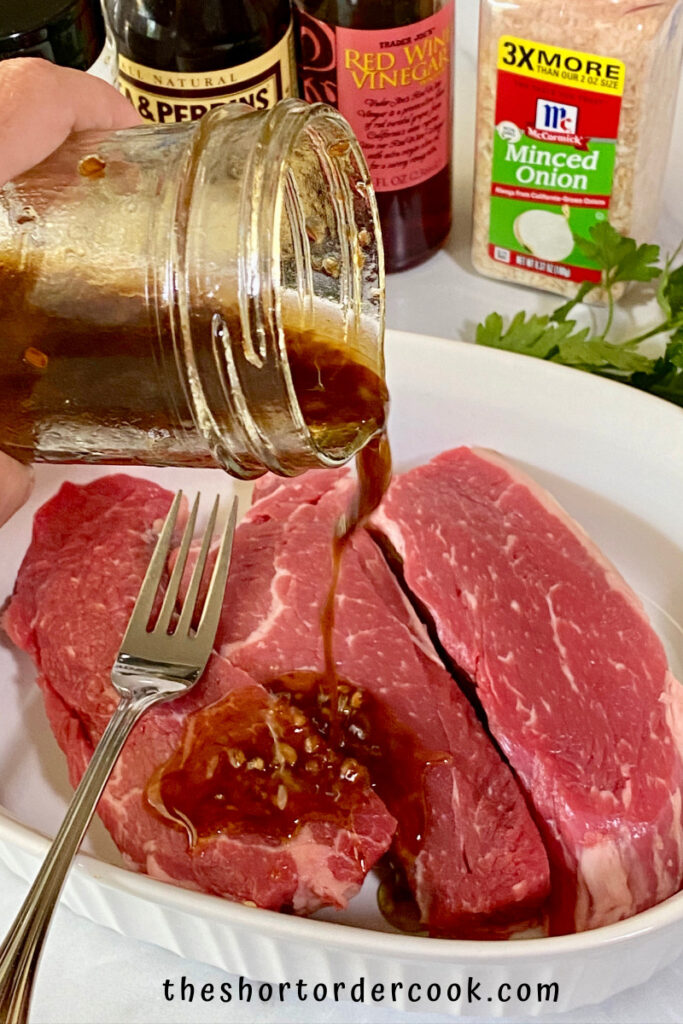 Keto Steak Marinade pouring over the meat