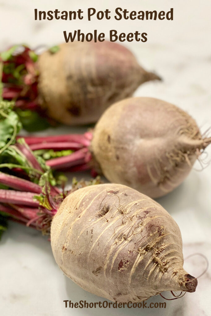 Instant Pot Steamed Whole Beets PN1 3 raw whole beets with beet greens still attached on the counter