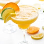 What to Serve with Fajitas frozen-citrus-margaritas mapleandmango a glass of orange colored frosty margaritas