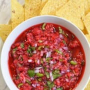 What to Serve with Fajitas homemade-raspberry-salsa-dip-1 fitmealideas bowl of bright red salsa and chips