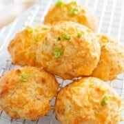 What to Serve with Lobster Cheddar-Biscuits-Set-1-7-683x1024 mommalew overhead photo of a pile of 6 biscuits on a cooling rack