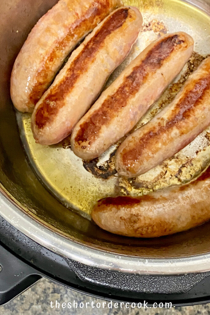 Instant Pot Italian Sausage & Peppers browned at the bottom of the insert