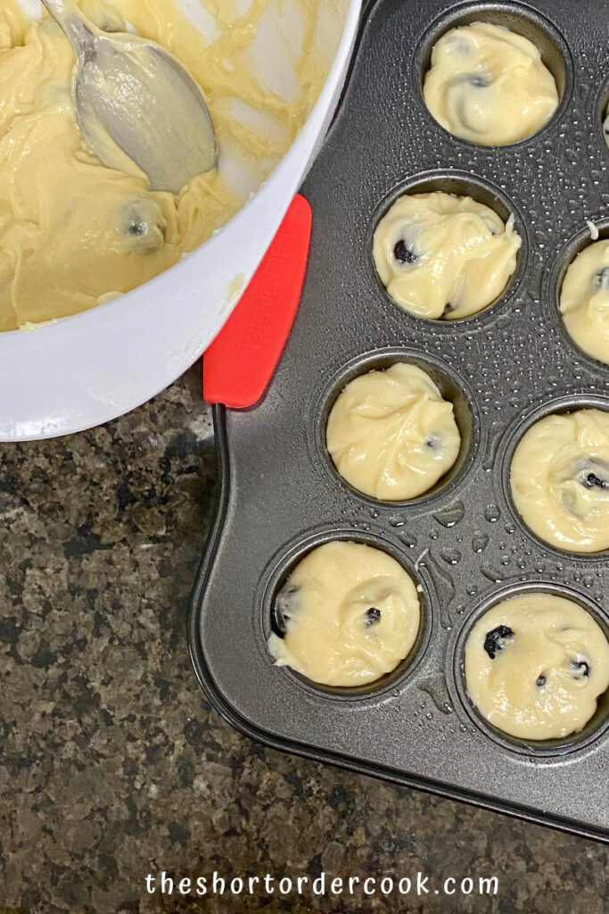 Old-Fashioned Mini Blueberry Muffins batter ready and filling the muffin tin