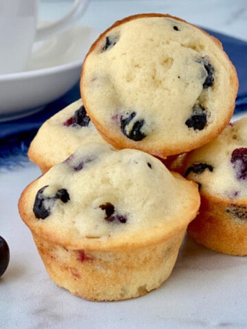 Old-Fashioned Mini Blueberry Muffins featured stack of muffins