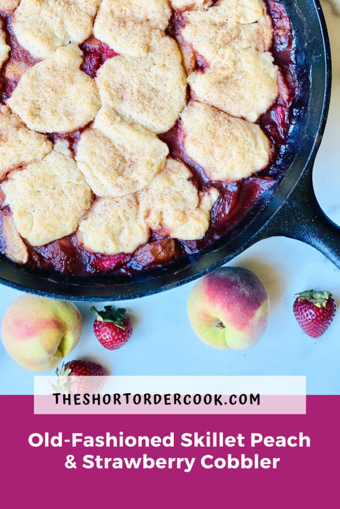 Old-Fashioned Skillet Peach & Strawberry Cobbler PIN overhead close up of skillet filled with cobbler