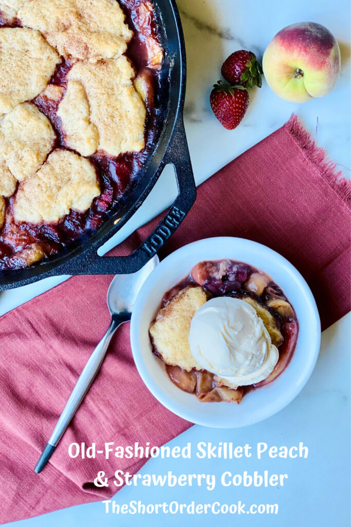 Old-Fashioned Skillet Peach & Strawberry Cobbler PN2 skillet in the top left corner and a bowl centered with cobbler topped with vanilla ice cream