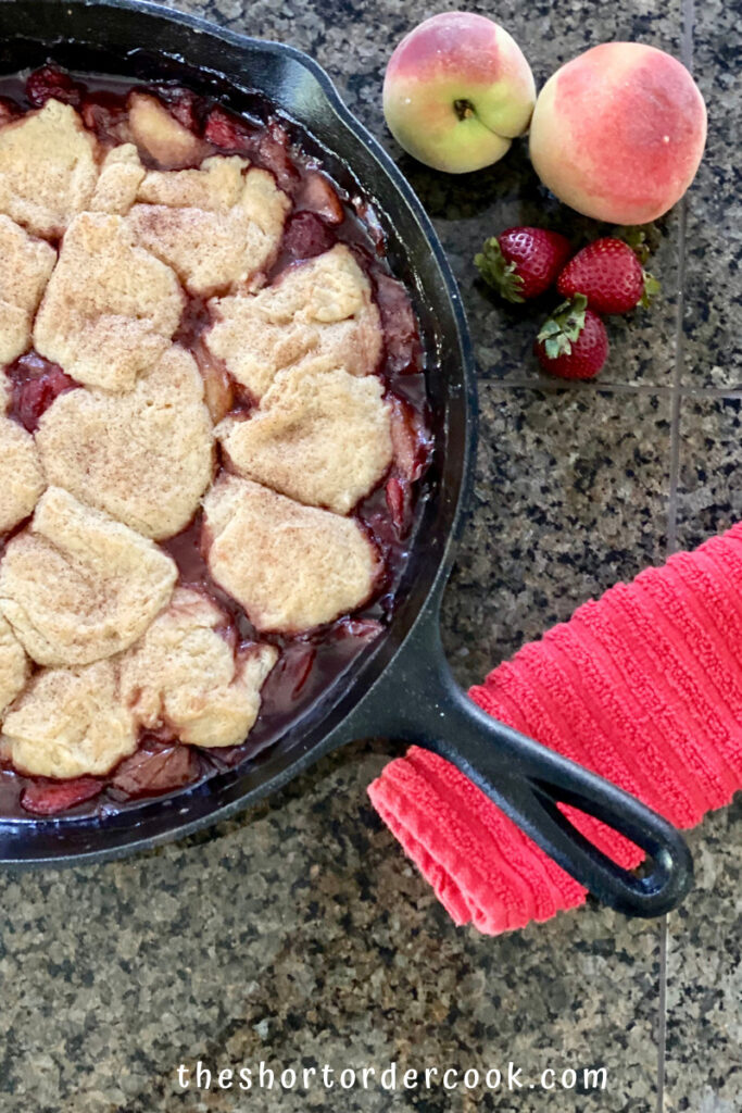 Old-Fashioned Skillet Peach & Strawberry Cobbler hot and out of the oven