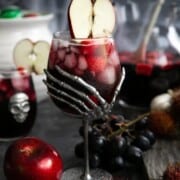 Vegan Halloween Treats & Drinks Coco-Cola-Halloween-7-700x1050 theforkedspoon a spooky hand wine glass filed with red sangria and topped with an apple slice