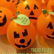 Vegan Halloween Treats & Drinks Treat-Filled-Pumpkins_Title momsandmunchkins orange round balloons with black marker faces drawn on them