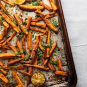 What to Serve with Sandwiches 20191111-sweet-potato-fries-1-2-XL sidewalkshoes overhead image of a sheetpan with cooked sweet potato fries sliced in shoestring cuts and sprinkled with chopped fresh parsley