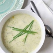 What to Serve with Sandwiches download_20190531_080758 seasonedandthyme overhead image of white bowl filled with leek soup and chives on top