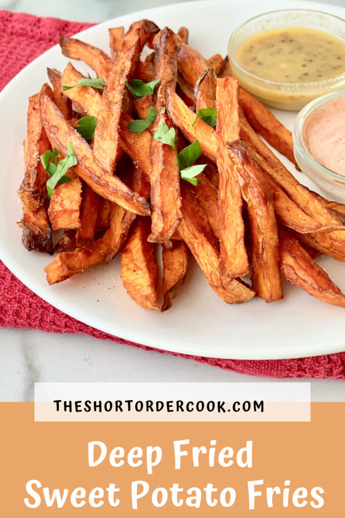 Deep Fried Sweet Potato Fries PIN a closeup of a white plate with fried sweet potato fries sprinkled with parsley