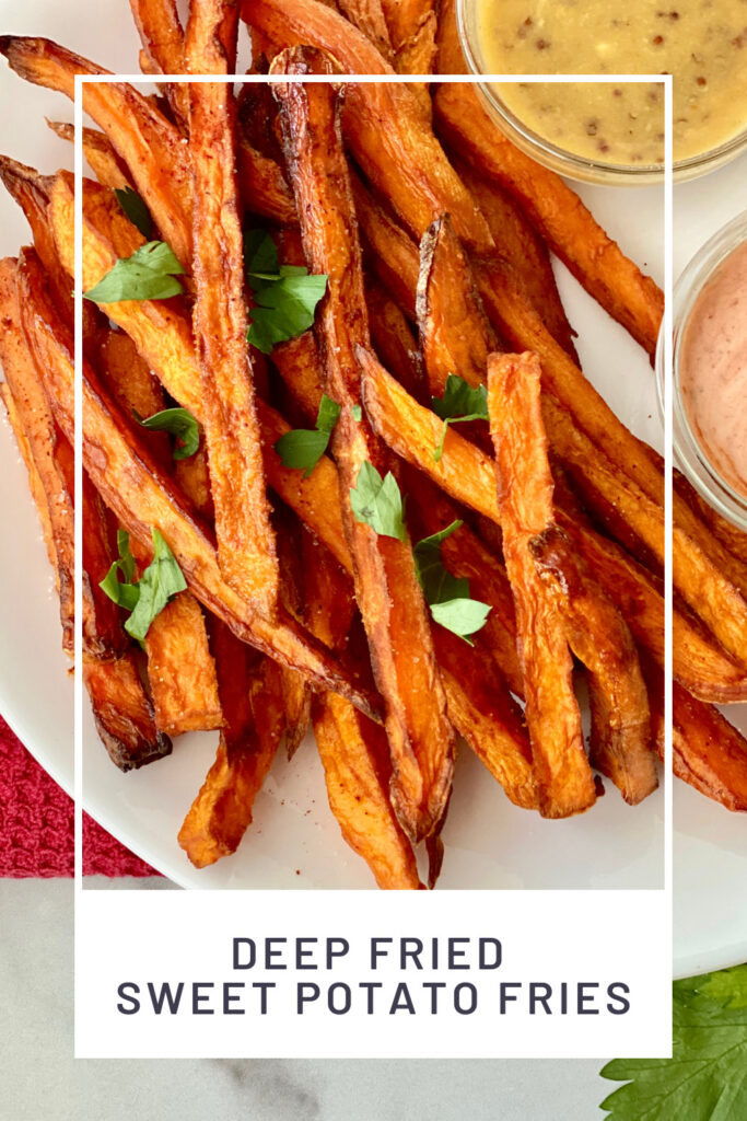 Deep Fried Sweet Potato Fries PINREDO closeup of shoestring sweet potato fries sprinkled with parsley