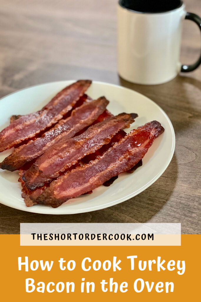 How to Cook Turkey Bacon in the Oven PIN a plate full of cooked turkey bacon and a mug of coffee on a table