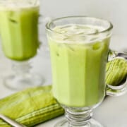 iced Matcha Latte (Starbucks Copycat) featured two cups with napkin and spoon recipe card