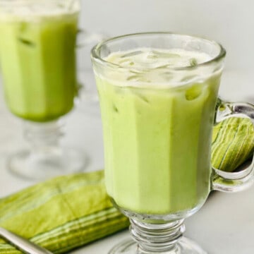 iced Matcha Latte (Starbucks Copycat) featured two cups with napkin and spoon recipe card