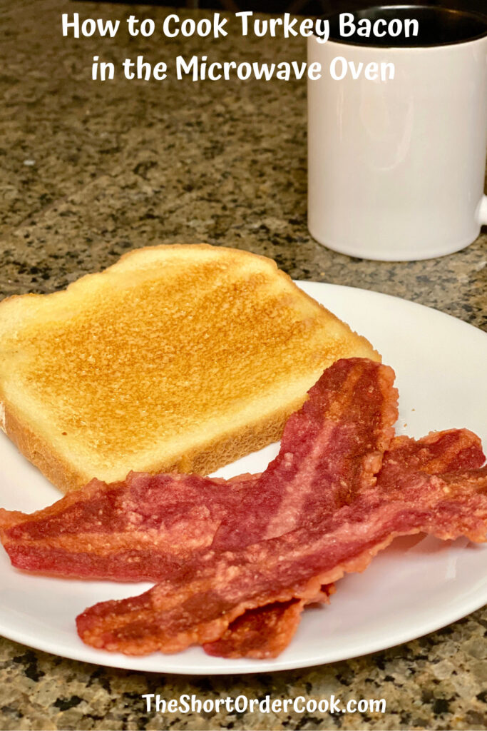 How to Cook Turkey Bacon in the Microwave Oven PN1 a white plate with 3 strips cooked bacon a slice of toast and a coffee mug in the background
