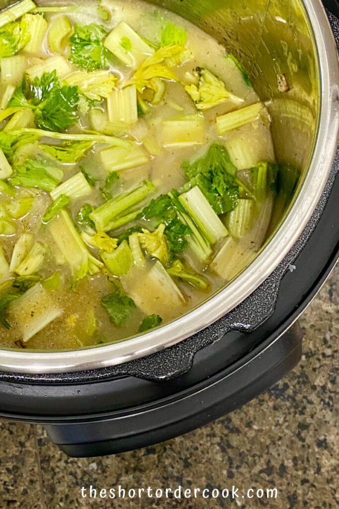 Instant Pot Cream of Celery Soup ingredients in the instant pot to cook