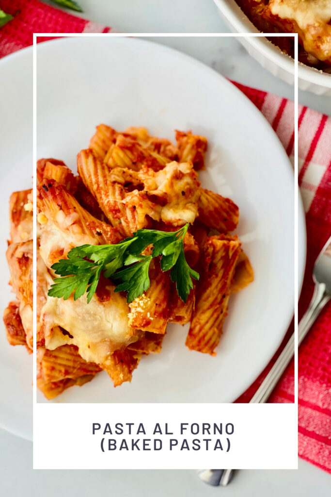 Plate of baked rigatoni pasta.