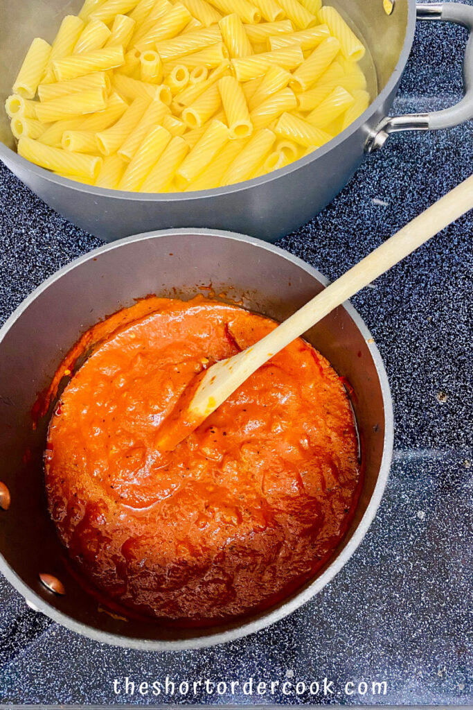 Pasta al Forno (Baked Pasta) pasta cooked and tomato sauce ready in pots