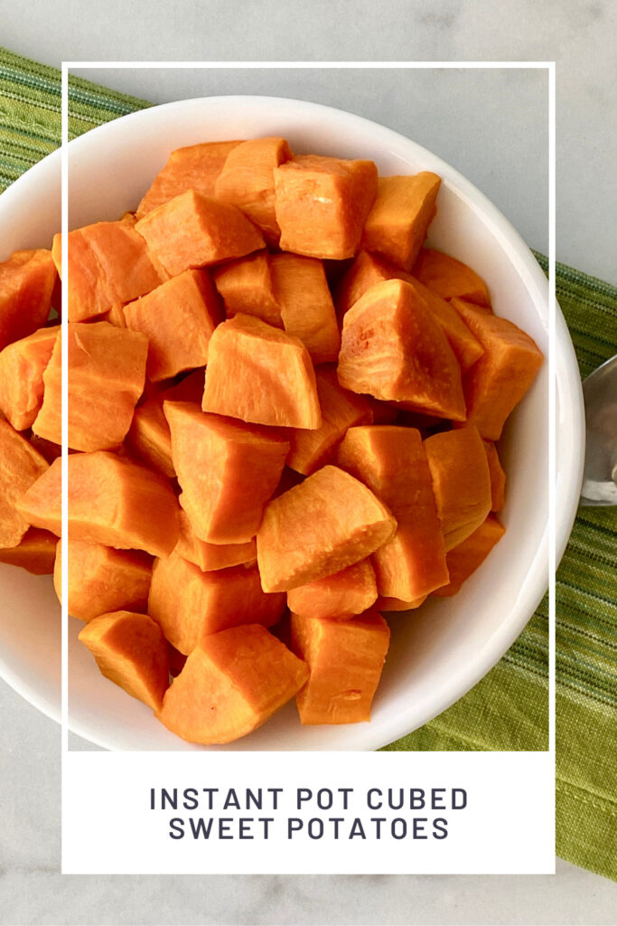 Instant Pot Cubed Sweet Potatoes PINREDO overhead picture of a bowl filled and a green cloth napkin and spoon