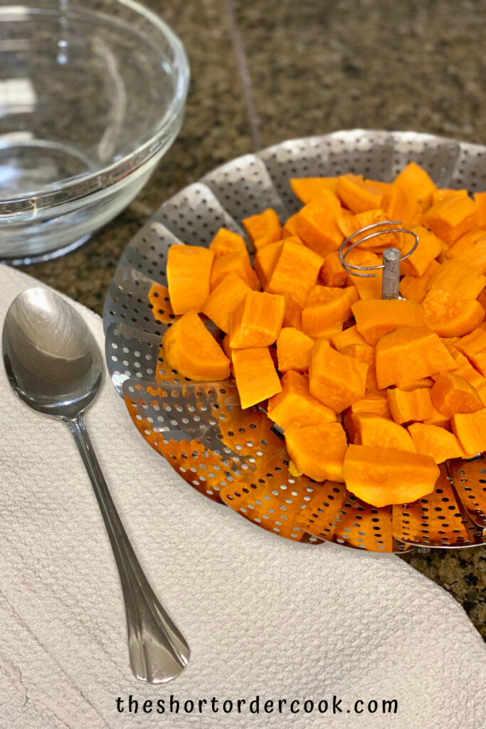 Instant Pot Cubed Sweet Potatoes the steamer out of the pressure cooker and on the counter to serve