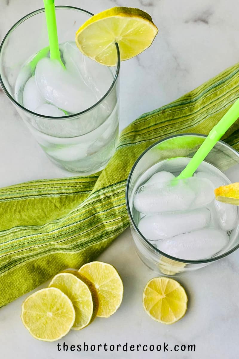 Texas Ranch Water overhead ready to drink with green straws and lime slices on the glass rim