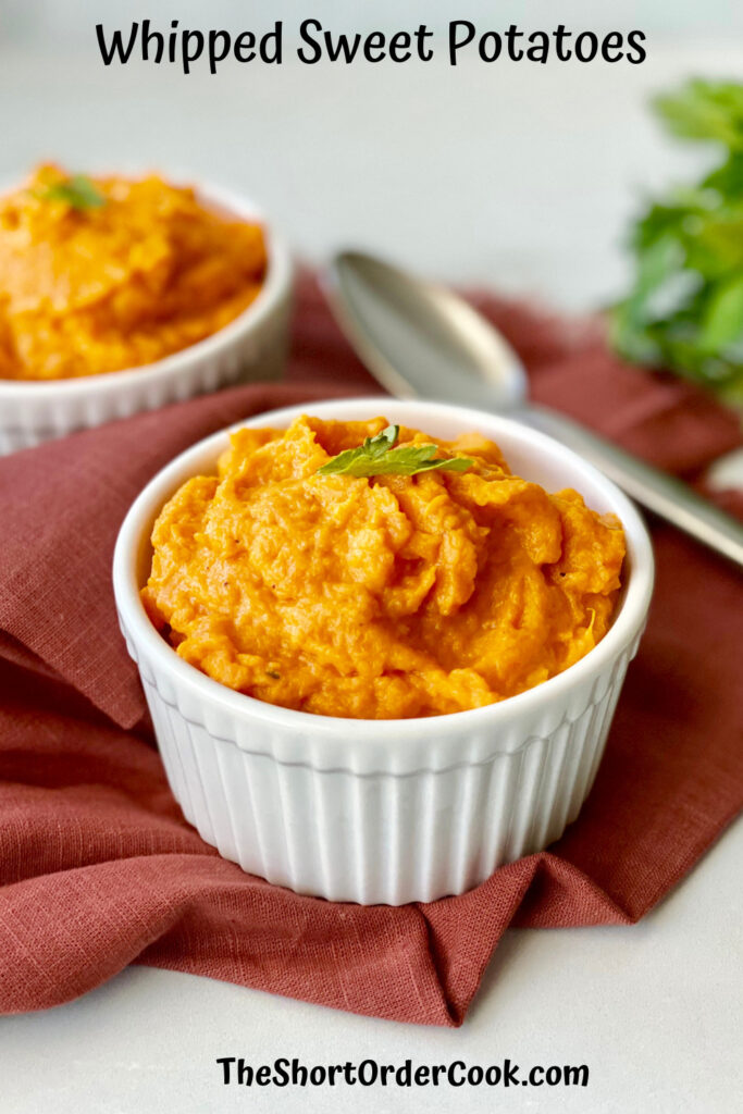 Whipped Sweet Potatoes PN1 a red cloth napkin topped with two ramekins filled with orange fluffy sweet potato